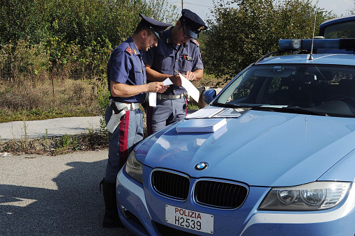 Arezzo (Italy), November 1, 2016. Roadside checks by traffic police officers for drunk driving licenses with patrol cars. Minutes and fines are issued for drivers who are not in compliance.
