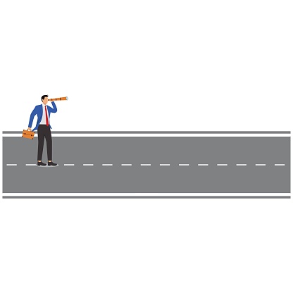 Businessman standing on the road