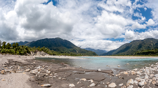 West Coast inland panoramic landscape with lush green native forest and blue waters, Hidden Gem of New Zealand