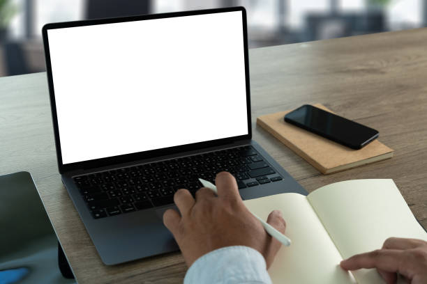 istock young man working Businessman using a desktop computer of the blank screen 2080313107