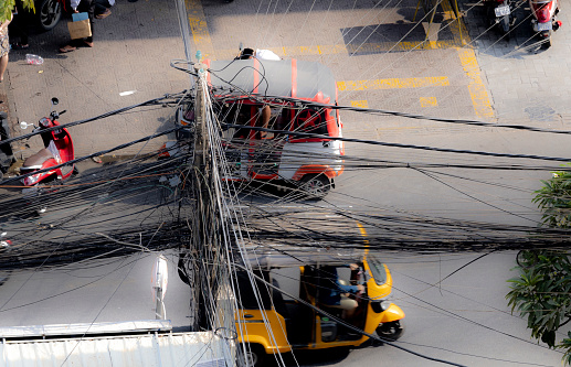 Phnomh Penh, Cambodia on Feb 23, 2024: typical cable wiring on the streets of Phnomh Penh