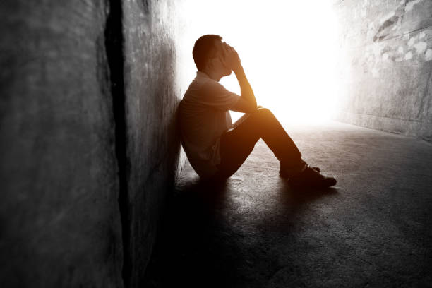 istock Desperate man sitting in the tunnel 2080336877