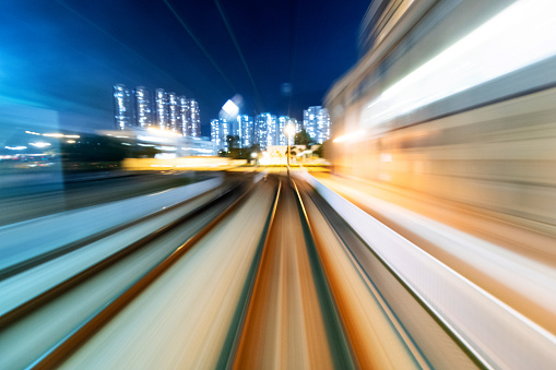 Motion blur railroad track in the city at night.
