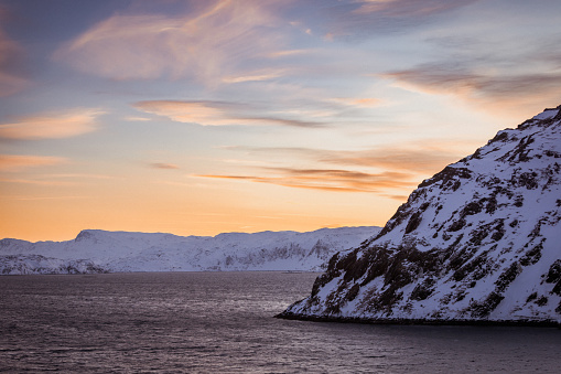 Winter landscape at sunset in arctic circle.\nHammerfest - Norway.