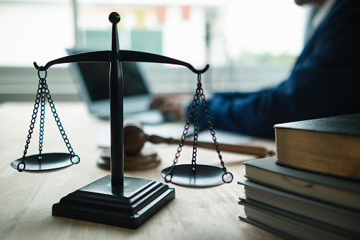 Brass scales are placed on lawyers desks in legal advice offices as a symbol of fairness and integrity in the High Court decision making. Brass scales were used as a symbol of honesty and justice.