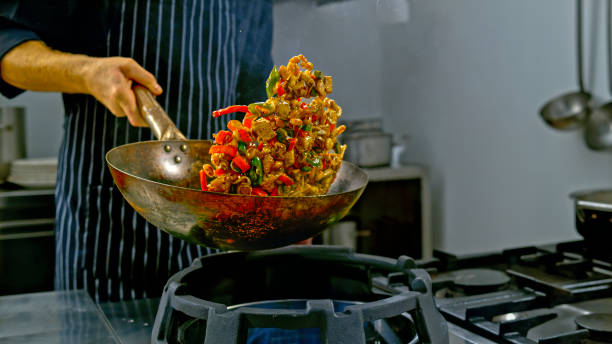 istock Chicken stir fry being tossed in a wok 2080391588