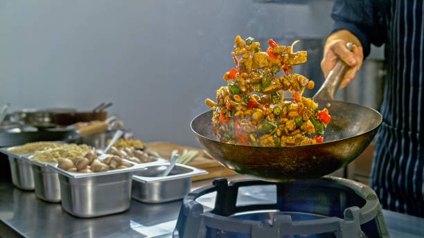 istock Chicken stir fry being tossed in a wok 2080392683