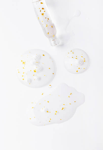 istock serum pipette serum gel essence texture with gold on white background 2080393101