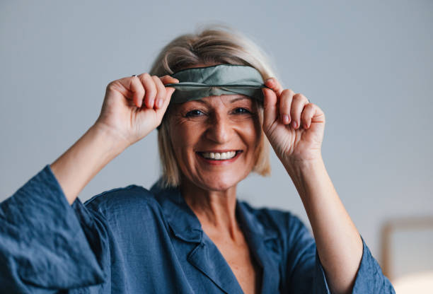 istock Portrait of a Playful Older Woman Pulling up a Sleeping Mask 2080405877