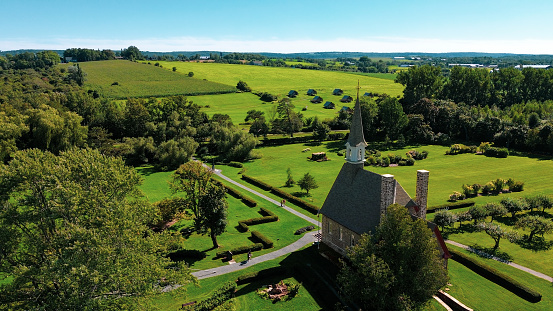 Grand-Pré, Nova Scotia - August 2023: Drone shot of the Memorial Church in Grand-Pré National Historic Site, it was built in 1922. It commemorates the the  area as a centre of Acadian settlement from 1682 to 1755 and the Deportation of the Acadians, from 1755 and continued until 1762.