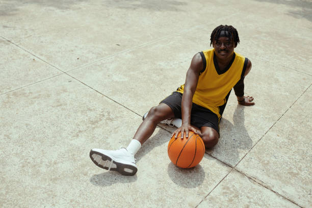 istock Streetball Player Resting on Ground 2080423862