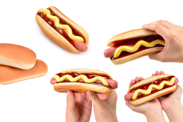 istock Hot dog in woman hand isolated on white background. Copy space. 2080437023