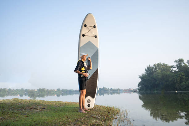 Standing up paddling at lake