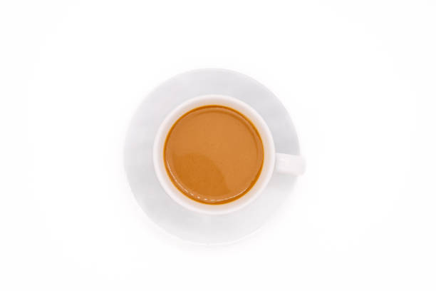 istock Creamy coffee on a white porcelain cup, isolated on white background with copy space. Top view or flat lay. 2080458783