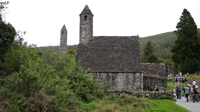 View of Glendalough ruins in Wicklow Ireland, view of Glendalough abbey, view of Glendalough upper and lower lakes in Ireland, popular tourist destination in Ireland