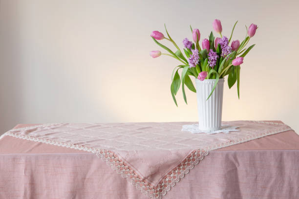 istock spring flowers in white vase in vintage style 2080536736
