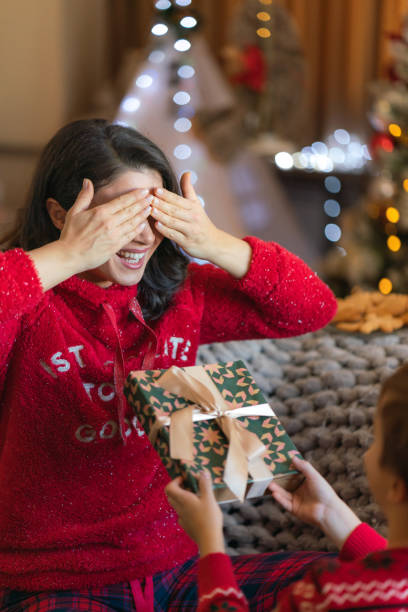 istock A happy mother receives a Christmas present from her son 2080543554