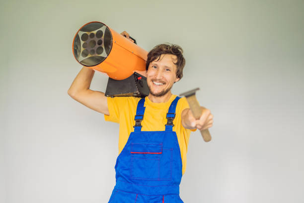 istock Male foreman for installing stretch ceilings with air heater 2080562515