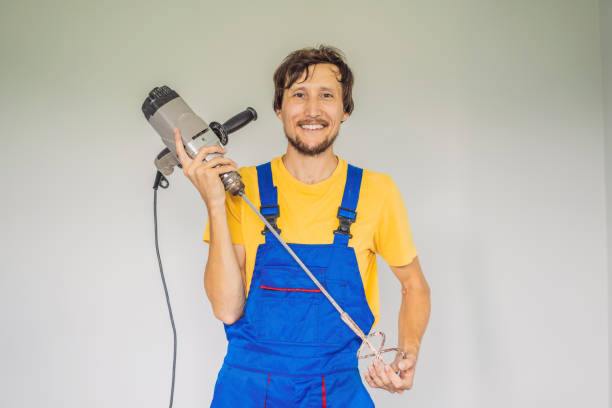 istock The master at the construction site with a construction mixer 2080562520