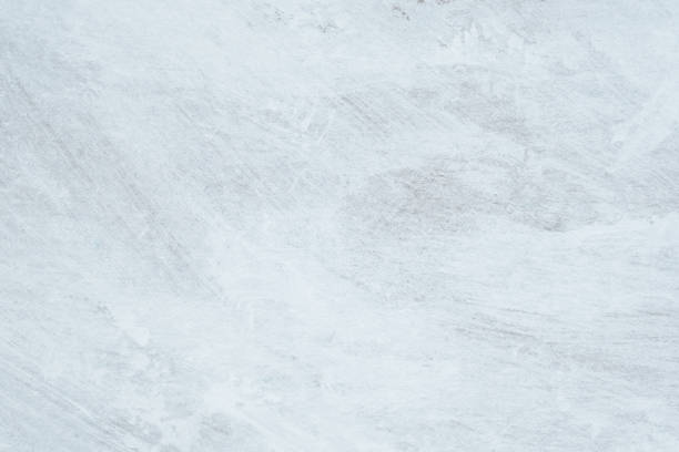 istock Fragment of an unevenly painted wall with white paint as a background 2080574067