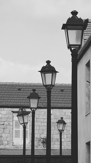 Descending Street Lamps in Black and White