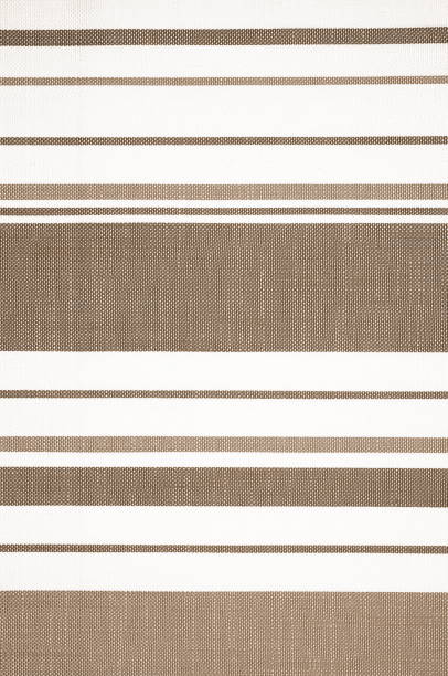 istock Classic Stripe Pattern on a Textured Fabric Background. The Elegant Simplicity of a Brown and White Textile 2080592874