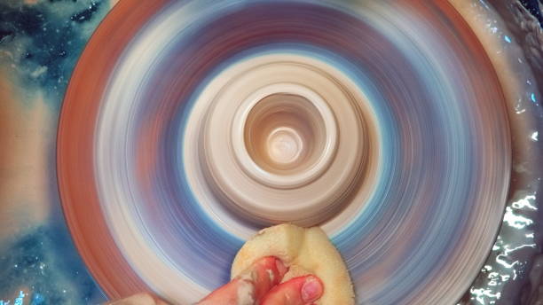 Pottery Wheel in Action with Spinning Clay and Artist's Hand