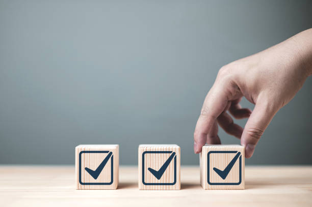 istock Inspection and certification of standards. Check mark on wooden block. 2080603302