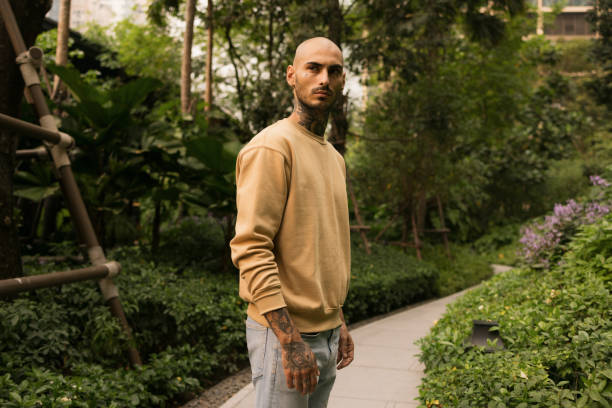 istock Serious hipster man standing in the park. 2080610609