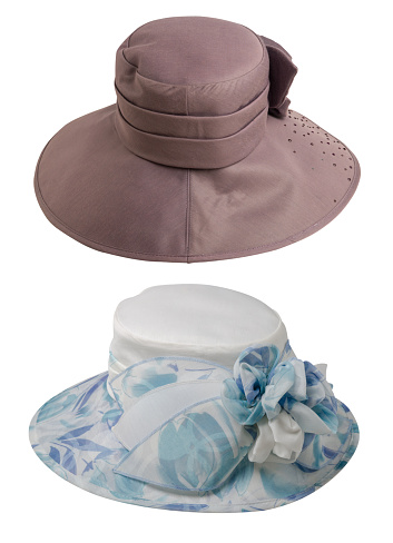 two brown and blue white beack hats with a brim isolated on white background