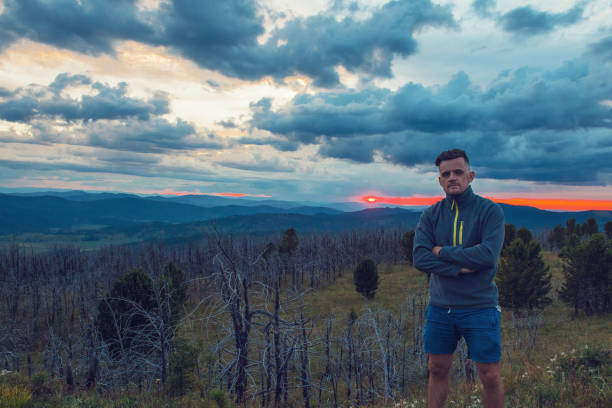 istock Man standing on top of cliff 2080622098