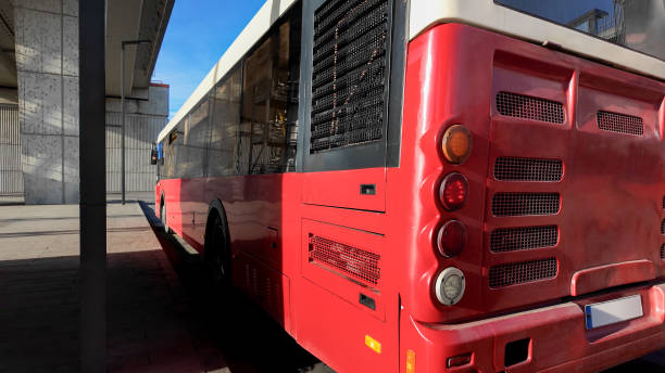 istock Red commuter bus for public transportation at a station. 2080624709