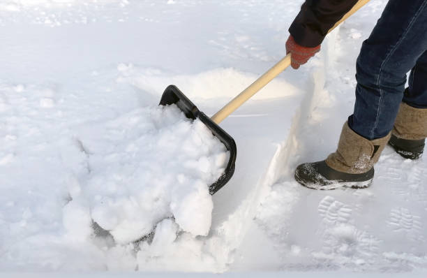 istock A man cleans the path from snow with a shovel. Snow removal 2080631001