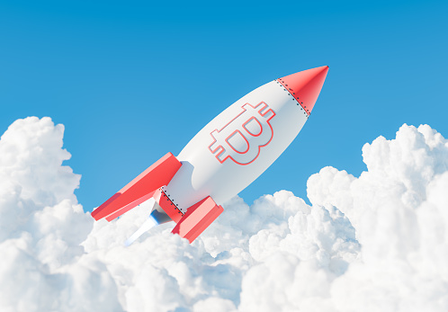 3D rendering of a rocket adorned with the Bitcoin symbol soaring through fluffy clouds against a clear blue sky. Concept of rise in cryptocurrency value.