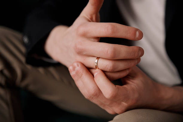 istock A man's hand with a gold wedding ring in close-up 2080662610