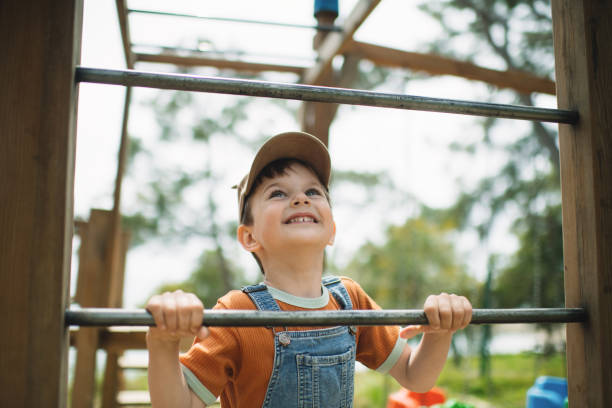 istock Cute child playing at  playground in summer park 2080668337