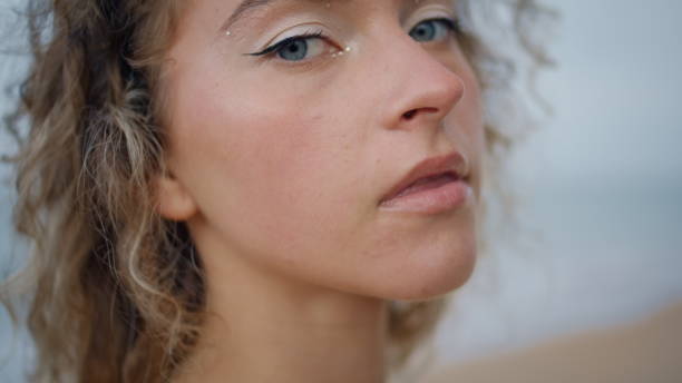 istock Portrait confident lady beach with shiny makeup. Woman looking camera seashore 2080668340