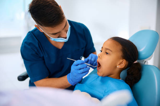 istock Small black girl during teeth examination at the dentist. 2080696170