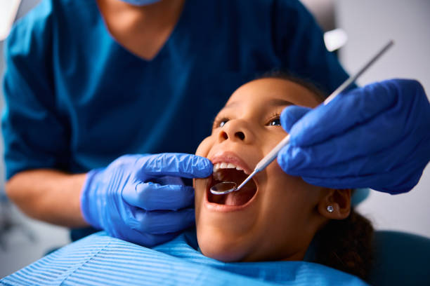 istock Black little girl during teeth examination at dentist's office. 2080696778