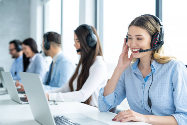 istock Businesswoman in an office, using laptop and wireless technology to communicate while listening and talking to client. 2080711749