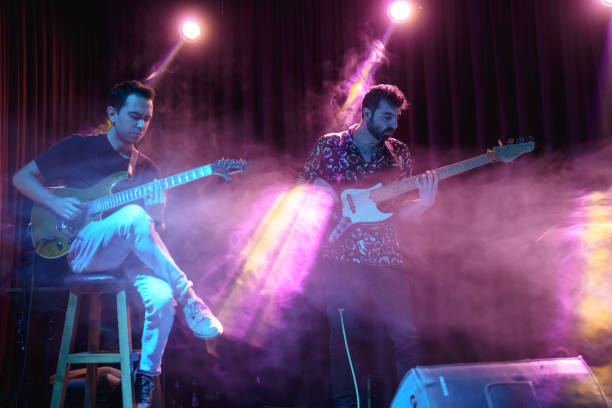 istock Music Band Performing on, stage light and smoke effects. 2080714774