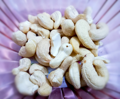 Cashew nuts. Plain Kaju of different types. Cashews are rich in fiber, protein, and healthy fats. Cashew nuts in the glass bowl.