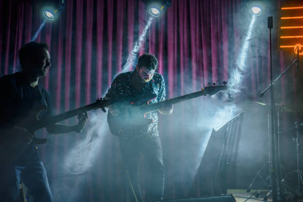 istock Music Band Performing on, stage light and smoke effects. 2080773482