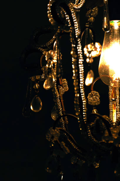 istock A chandelier with a light shining on it 2080777705