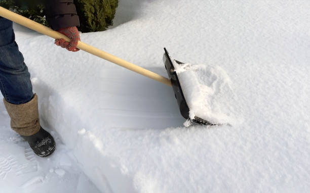 istock A man cleans the path from snow with a shovel. Snow removal 2080789816