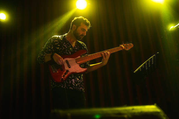 istock Music Band Performing on, stage light and smoke effects. 2080802884