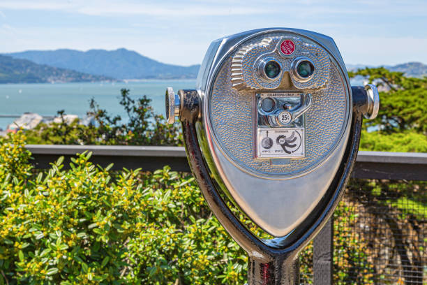 Coin operated binoculars or telescope popular in United States on tourist places. Touristic binocular telescope look at the city with view mountains. Close up Coin operated in panorama observation