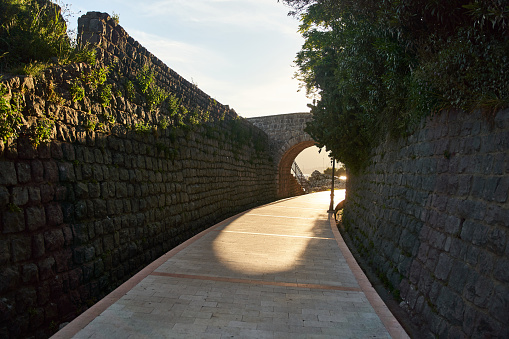Road through stone walls with arch in Herceg Novi, Montenegro. High quality photo