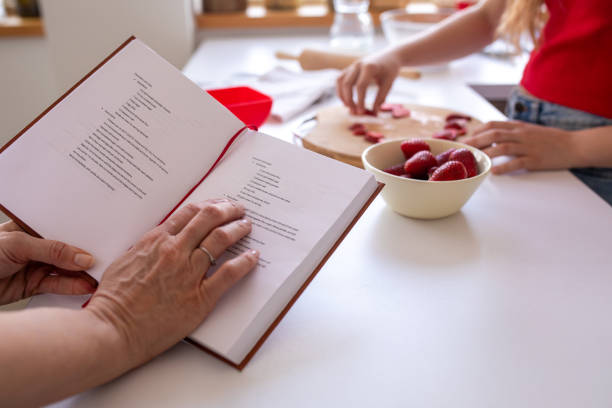 istock Two women using a recipe to make a cake at home 2080907851