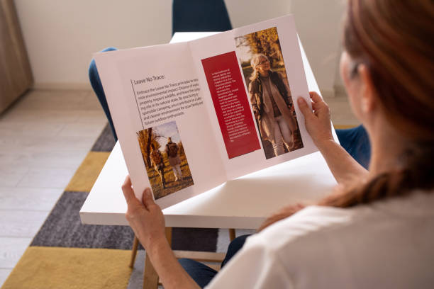 istock Mother reading a magazine with her daughter at home 2080910352